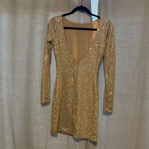 High collar, low back party dress.